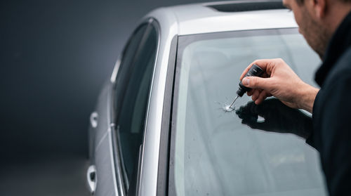 Applying Crafftora GlassFix resin to a stone chip on a car windshield